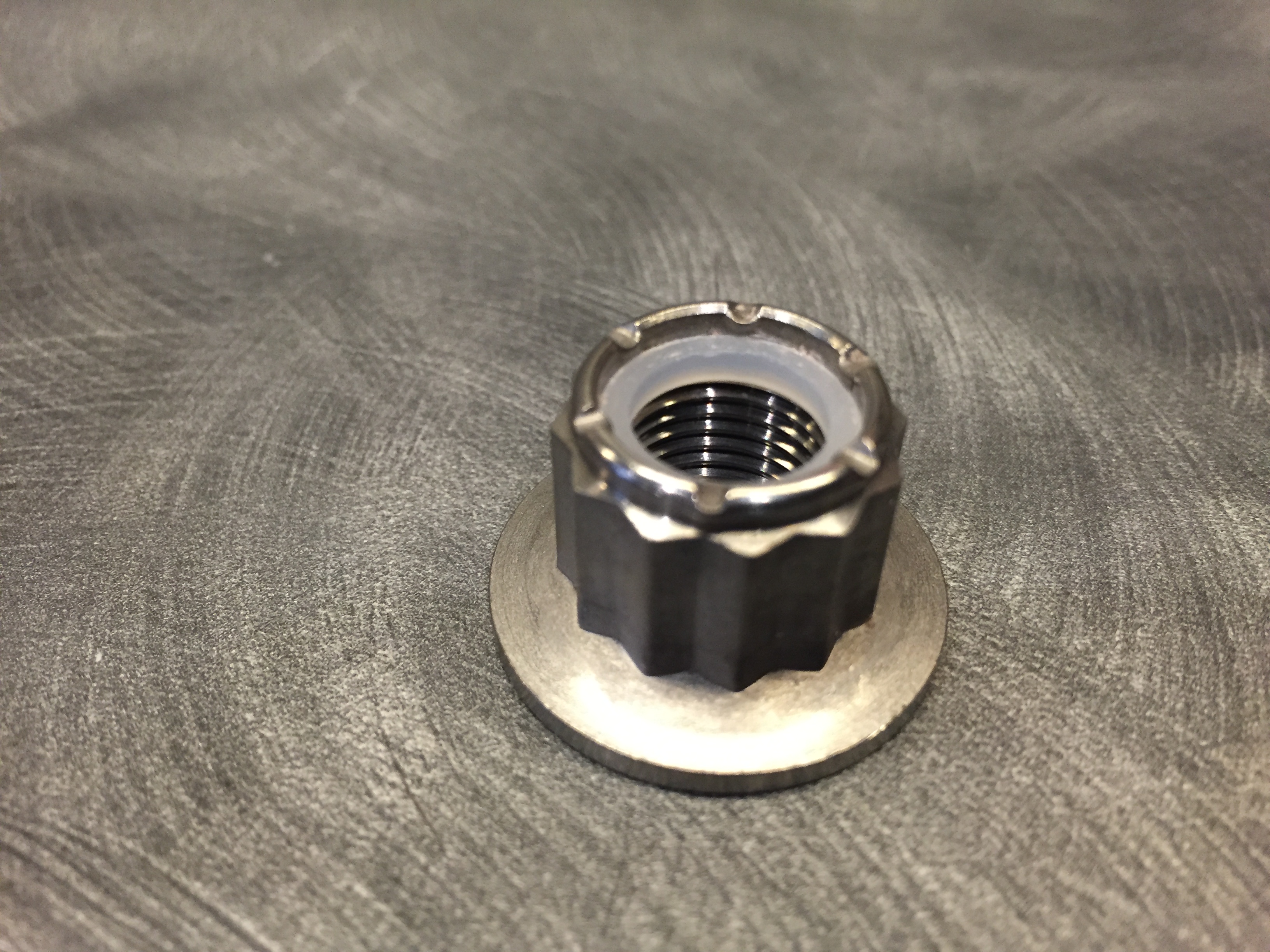 Titanium M12 x 1.25 Flange Nyloc Nut, Carbon 6 Composites